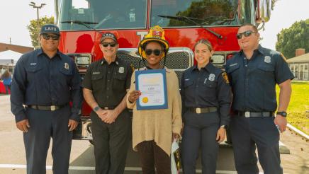 Asm. McKinnor presenting an award to LAFD first responders