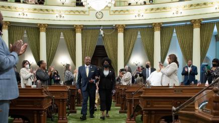 Asm. Jones-Sawyer walking Asm. McKinnor down the aisle