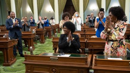 Asm. McKinnor being applauded by other members