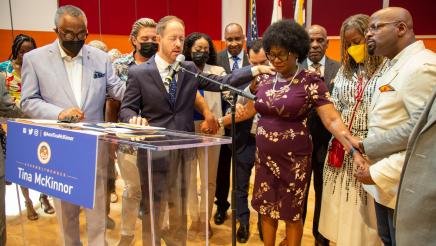Asm. McKinnor joining guests in prayer