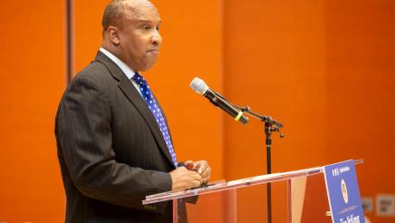 Guest speaker, speaking at podium
