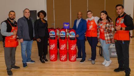 Asm. McKinnor and Home Depo employees with emergency kits