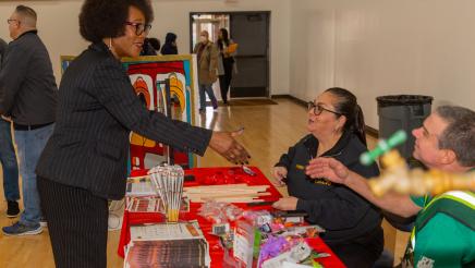 Asm. McKinnor greets CERT members at display table