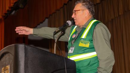 CERT member at podium, speaking