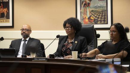 Asm. McKinnor and staffers listening to testimony