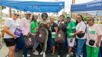 Group photo of Asm. McKinnor and happy attendees