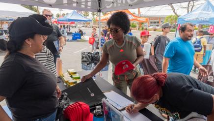 Asm. McKinnor viewing free items at resource booth