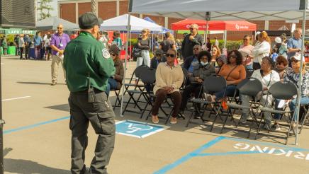 LAFD staffer speaking to group of seated attendees