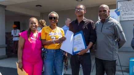 Asm. McKinnor awarding scholarship to student, with Sen. Bradford and Councilmember Faulk