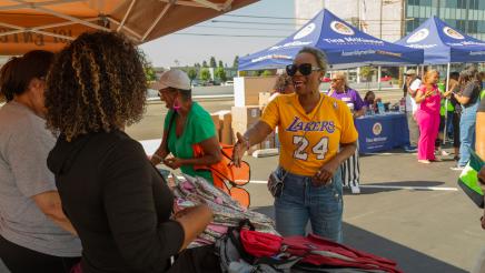 Asm. McKinnor greeting booth volunteers