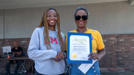 Asm. McKinnor awarding scholarship to student