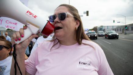 March organizer speaking into megaphone