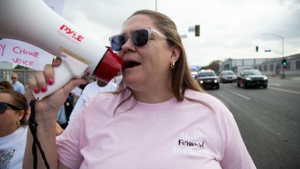 March organizer speaking into megaphone