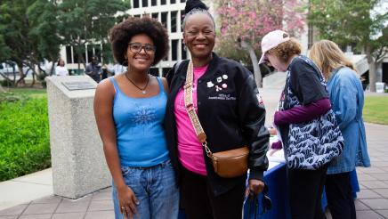 Asm. McKinnor and constituent smiling