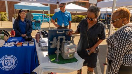 Asm. McKinnor examining SoCalGas display