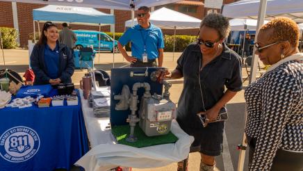 Asm. McKinnor examining SoCalGas display