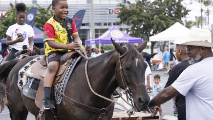 Child enjoying horse ride