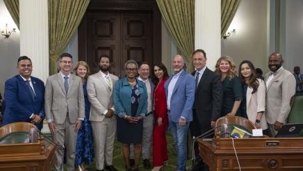 Group photo of Asm. McKinnor and other members on the Assembly Floor