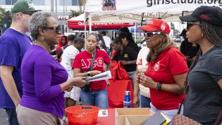 Asm. McKinnor speaking with Delta Sigma Theta booth staffers