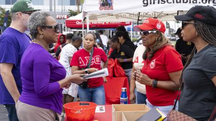 Asm. McKinnor speaking with Delta Sigma Theta booth staffers