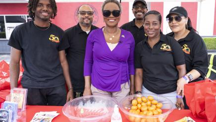 Asm. McKinnor with GCLA booth staffers