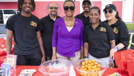Asm. McKinnor with GCLA booth staffers
